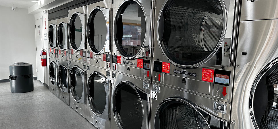 Row of Speed Queen commercial dryers at TF Handy Wash